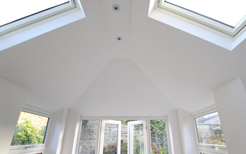 Inside a conservatory with a solid roof