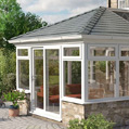 Conservatory with a solid tiled roof